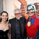 Daniela Melchior, James Gunn, John Cena pose together on the red carpet at The Suicide Squad premiere